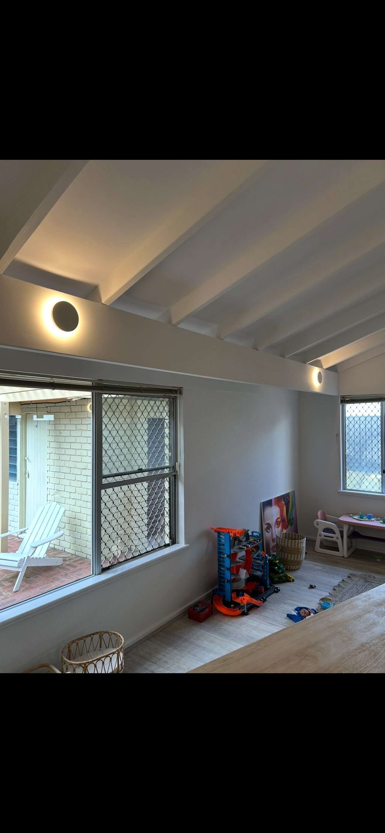 Feature wall lighting on a raked ceiling